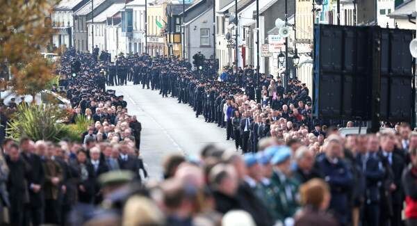 Crowds line the streets of Blackrock to watch the funeral on a large screen. Pic: Colin Keegan, Collins Dublin. Crowds line the streets of Blackrock to watch the funeral on a large screen. Pic: Colin Keegan, Collins Dublin.