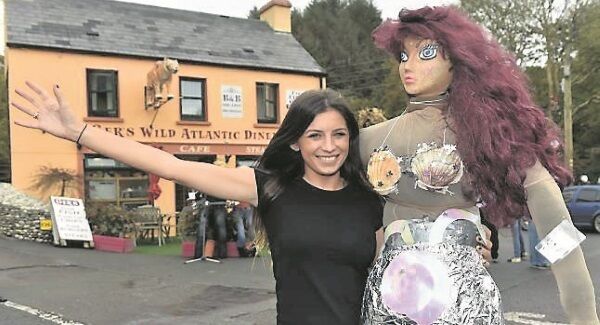 Ciara Cronin with her scarecrow mermaid welcoming visitors to the small West Cork village.