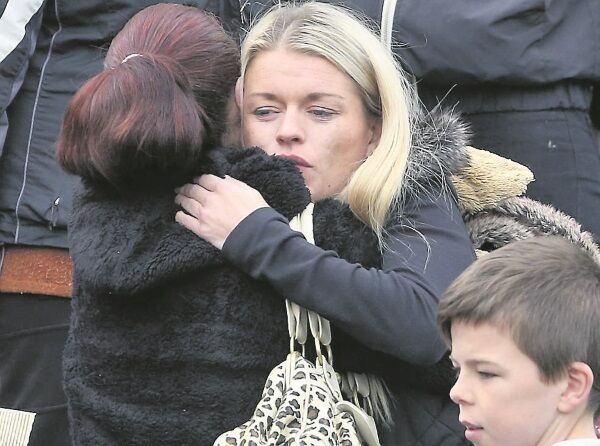 Mourners comfort each other. The funeral Mass was attended by representatives from the Government and President Michael D Higgins, while Archbishop Eamon Martin and Pope Francis sent messages