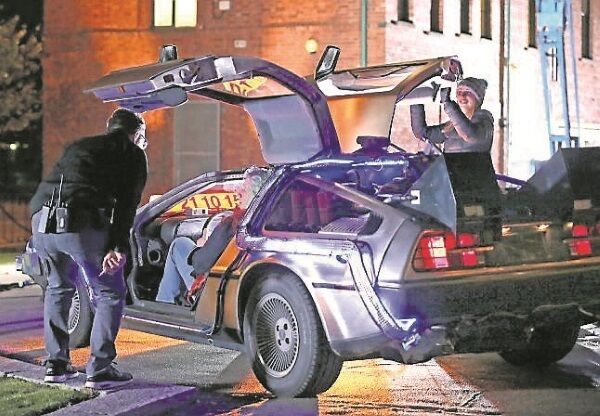 A crew working on behalf of Harp Brewery make a video using a DeLorean car to mark ‘Back to the Future’ Day in Belfast