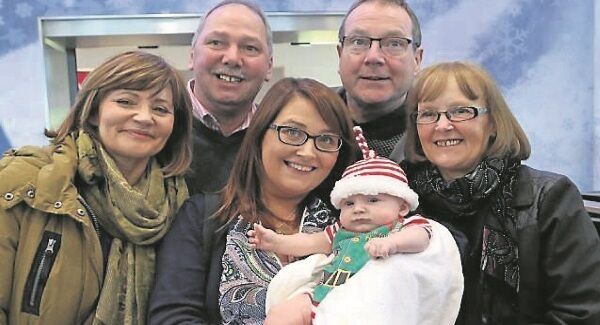 Emily McCullough and son Sonny are welcomed home by her family, from left, Cathy McCullough, Martin Murphy, Willie McCullough, and Angela Murphy at Dublin Airport. Picture: Colin Keegan