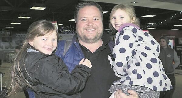 Richard Stephens, living in Canada, with his daughters Ava and Isabell, from Killaloe, after arriving home. Picture: Brian Gavin