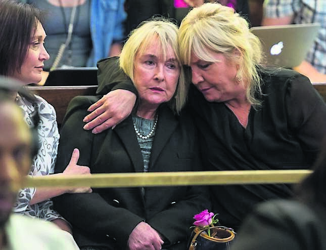 June Steenkamp, centre, mother of Reeva Steenkamp, is comforted as appeals court judge Eric Leach delivers his verdict. June Steenkamp, centre, mother of Reeva Steenkamp, is comforted as appeals court judge Eric Leach delivers his verdict.
