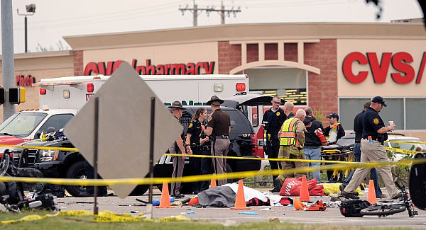 Emergency personnel gather after a vehicle crashes into a crowd of spectators during the Oklahoma State University homecoming parade. Pic: AP