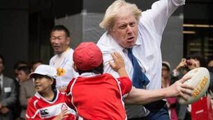Boris Johnson flattens Toki, 10, during street rugby game