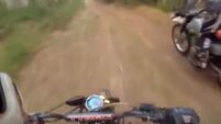 Lucky escape for dirt bikers who encounter a bear at top speed in a forest