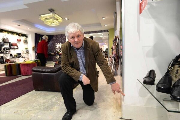 Fashion retailer Frank O’Leary indicating the flood water level in his business premises in Main St, Bandon. Picture: Denis Scannell Fashion retailer Frank O’Leary indicating the flood water level in his business premises in Main St, Bandon. Picture: Denis Scannell