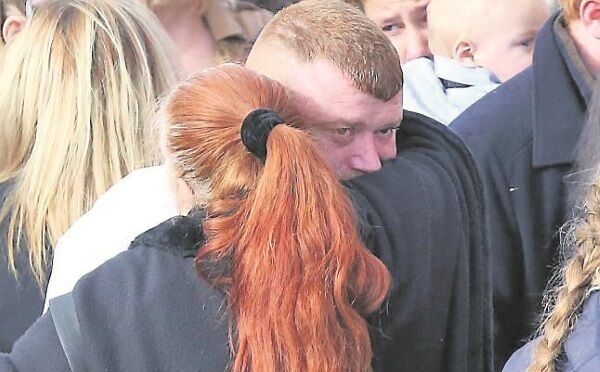 Relatives of the Connors family console each other at the funeral of Thomas, Sylvia, Christopher, Jim, and baby Mary Connors Relatives of the Connors family console each other at the funeral of Thomas, Sylvia, Christopher, Jim, and baby Mary Connors