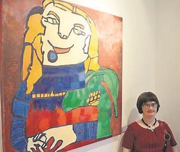 Ailbhe Barrett with one of her paintings in the outsider art exhibition Ailbhe Barrett with one of her paintings in the outsider art exhibition