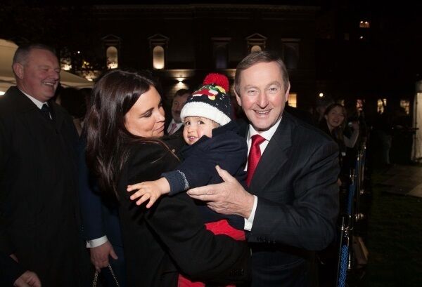 Taoiseach Enda Kenny bids season’s greetings to Aislinn Swanick and her son Julian, 2, as the Leinster House Christmas tree lights were switched on yesterday as the Dáil choir belted out some festive favourites. Picture: Gareth Chaney Taoiseach Enda Kenny bids season’s greetings to Aislinn Swanick and her son Julian, 2, as the Leinster House Christmas tree lights were switched on yesterday as the Dáil choir belted out some festive favourites. Picture: Gareth Chaney