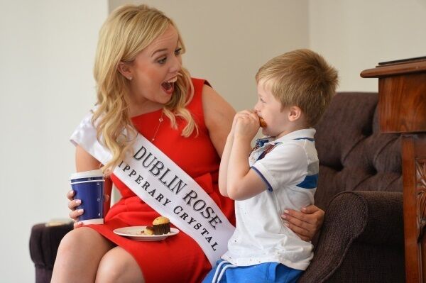 Billy Moloney, aged 3, from Kilkenny, sits down beside the Dublin Rose Lorna Whyte at the Rose Hotel Tralee Billy Moloney, aged 3, from Kilkenny, sits down beside the Dublin Rose Lorna Whyte at the Rose Hotel Tralee