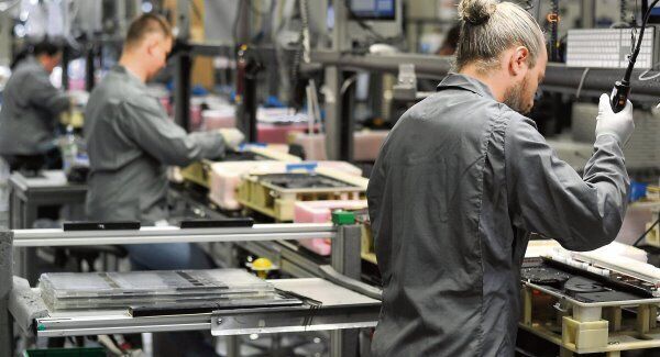 Employees working on the iMac production line at the Apple European Headquarters in Hollyhill, Cork. Picture: David Keane