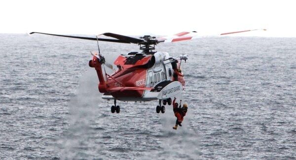Coastguard volunteer James Lucey is airlifted from the sea after he became trapped in a cave below the cliffs in Kilkee, Co Clare, where he sheltered when his boat capsized while searching for a man missing since Friday. Picture: Press 22