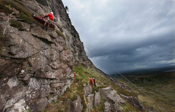John O’Sullivan, Kerry Mountain Rescue Team, abseils with Lawrence Macken carried on a stretcher, as part of the team’s rescue training on Porch Gully in the Gap of Dunloe, Killarney. The country’s oldest volunteer mountain rescue team is marking its 50th anniversary. Picture: Valerie O’Sullivan