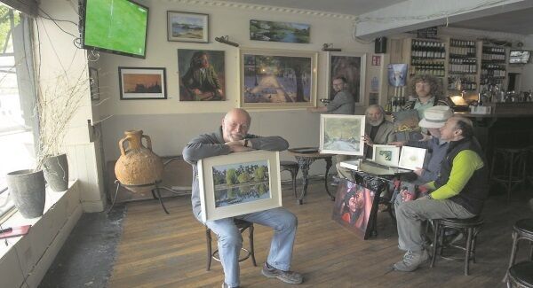 Hanging the exhibition at Henchy’s Bar were Joe McNicholas and Martin McHenry, organiser