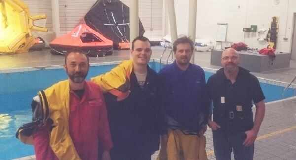 Alex Pereyaslavates, Harry Duggan, and Roger Valentine of the Commissioner of Irish Lights with NMCI Offshore training instructor Joe Morrison after carrying out a simulated helicopter crash training course at the National Maritime College Ireland at Ringaskiddy, Co Cork." May 12, 2016. Picture: Dan MacCarthy