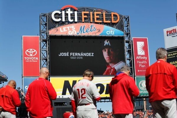 Members of the Philadelphia Phillies participate in a moment of silence to remember Miami Marlins Jose Fernandez