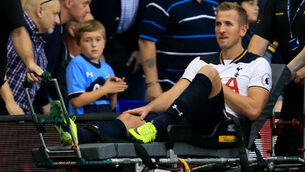 Spurs keep up pressure but have Harry Kane injury worry