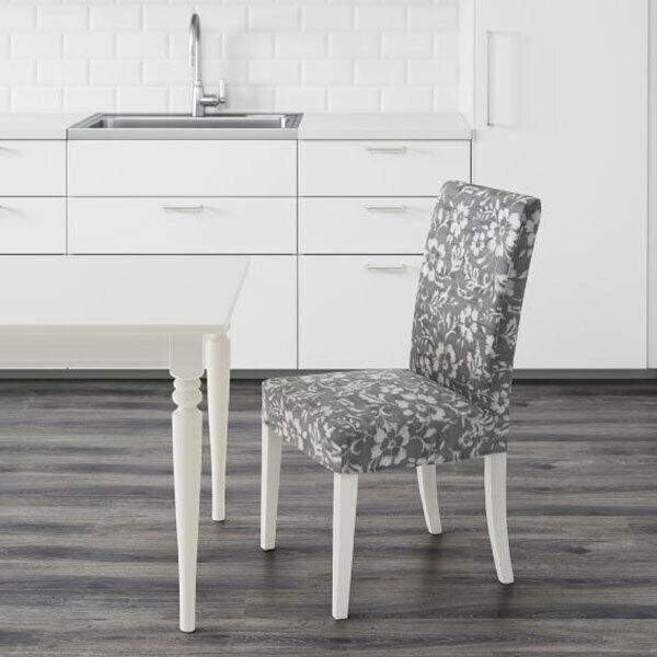 The Henriksdal upholstered chair is lightly patterned in stain concealing grey and white, and works with this traditional style table thanks to the common colour theme (chair Ä79 from Ikea).