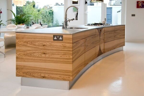 This stunning curved island unit in bookended cabinetry is part of the bespoke range from House of Coolmore, Cork. The company offers an innovative, one-off approach to modern units, but with timeless craft. houseofcoolmore.ie