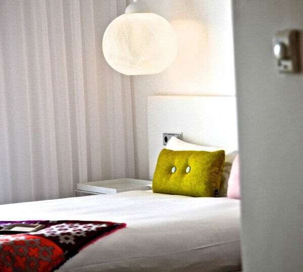 The bedrooms have pops of colour in the cushions and art work.