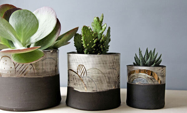 Black and gold detailed planters from KaroArt (€39.50).
