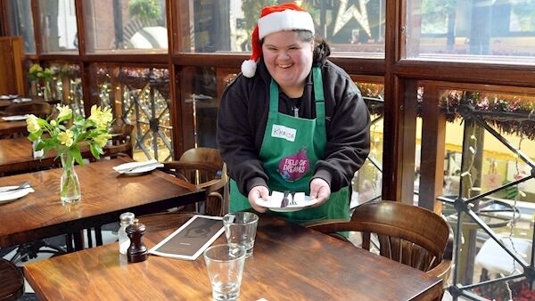 Khadija Bouncir, one of the students from Down Syndrome Cork Field of Dreams, setting the table in the Farmgate Café during work experience in the English Market, Cork. Picture: Denis Minihane