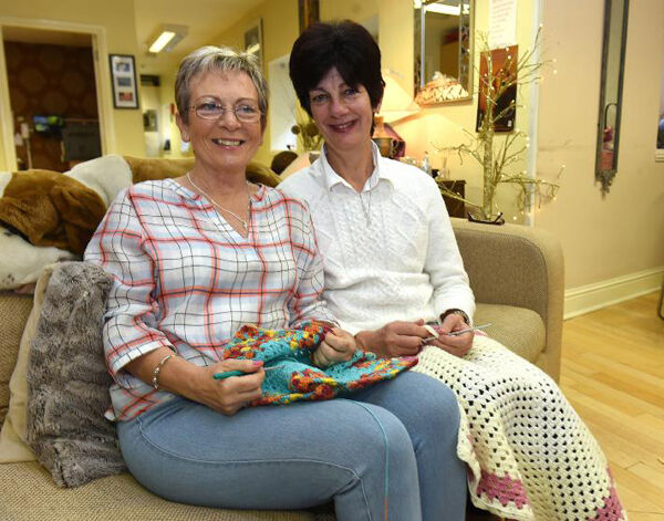 Margaret Walsh and Ann Goggin make ’Blankets of Hope’.