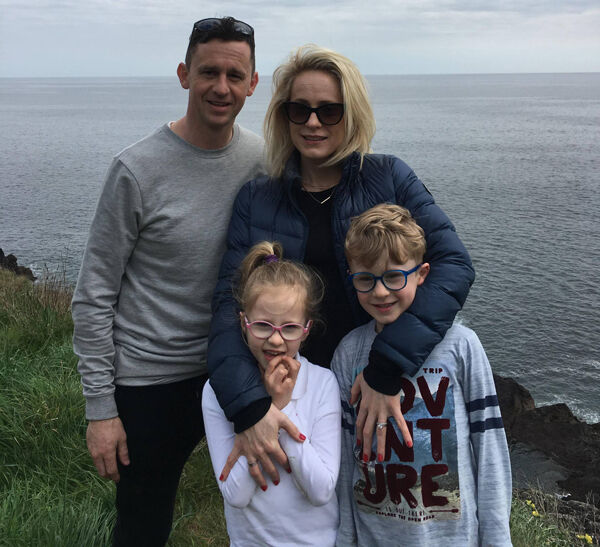 Toomevara clubman Ken Dunne with his wife, Helen, and children, Molly and KJ. ‘They showed us the scans (pre and post operation) and you could see the front right-hand side of my brain was a black blob (pre-op).’