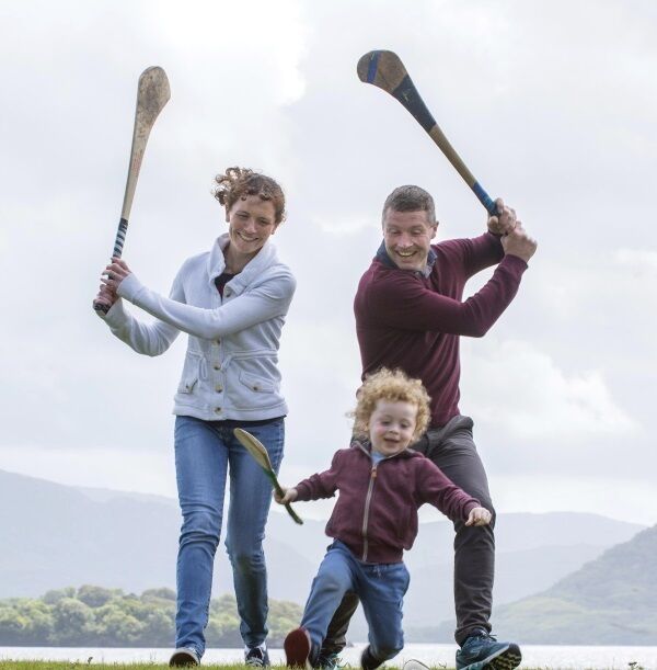 Former Galway hurler Damien Hayes and his wife Claire enjoy a puck around with their son Eanna while on holidays in Killarney.