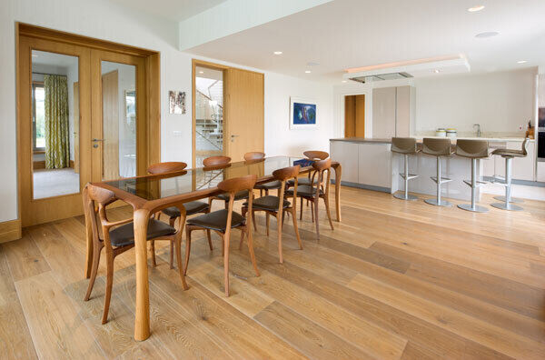 A spacious prep kitchen/pantry in this new build by KMC Homes allows the kitchen and living space to remain uncluttered and free. Concertina folding doors are out of shot, but provide for a seamless connection to the outside, while steps lead down to a family room.