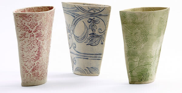 The Impressed Bouquet Vase is a large handmade vase with a slim profile and a wide slim opening for flowers. The vase is textured with wallpaper patterns and comes in green, ruby and cobalt blue colours. Retail price for one vase: €95.