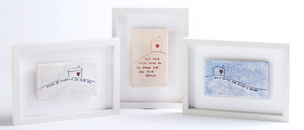 These handmade ceramic tiles from the Home Comforts range are impressed with a lacy pattern, and adorned with a simple line drawing of a house. Retail price for each framed tile: €85.