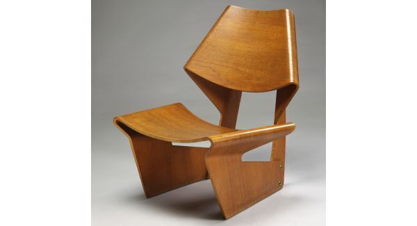 The GJ chair by Danish designer Grete Jalk was made in 1963, thanks to developments in plywood manufacture which facilitated moulded shapes.
