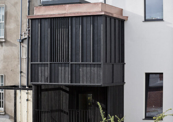 Black charred timber cladding on this extension to a period home on Grand Canal Street, Dublin. Black charred timber cladding on this extension to a period home on Grand Canal Street, Dublin.