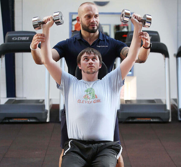 Trainer Janusz Halys at the Iveagh Fitness Club puts Caomhan through his paces. Pictures: Robbie Reynolds