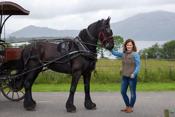 Killarney jarvey Laura Tangney with her horse ‘Oscar’ beside Lough Leane.