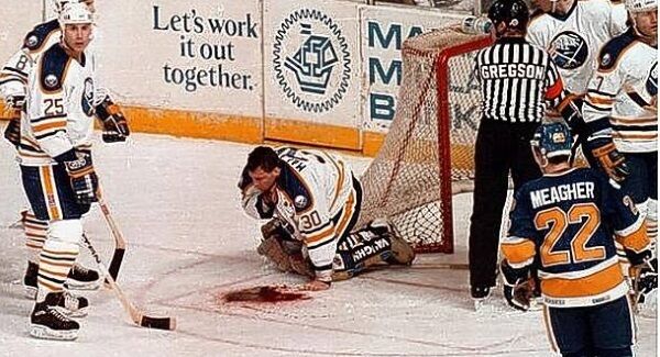 Buffalo goalie Clint Malarchuk suffered an horrific injury in the NHL when his jugular vein was partially severed in 1989. He survived thanks to the quick actions of team trainer Jim Pizzutelli. Picture: Harry Scull Jr