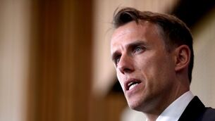 Neville shows mixture of regret and pride