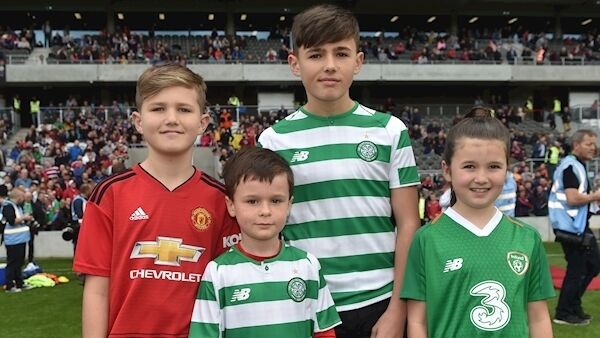Kory, Leo, and Belle Miller with their cousin James Sheedy, second left, at the Liam Miller tribute match at Páirc Uí Chaoimh, Cork. Picture: Dan Linehan