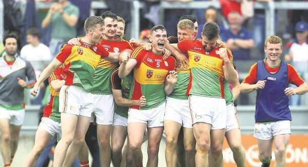 Carlow players celebrate their win over Kildare
