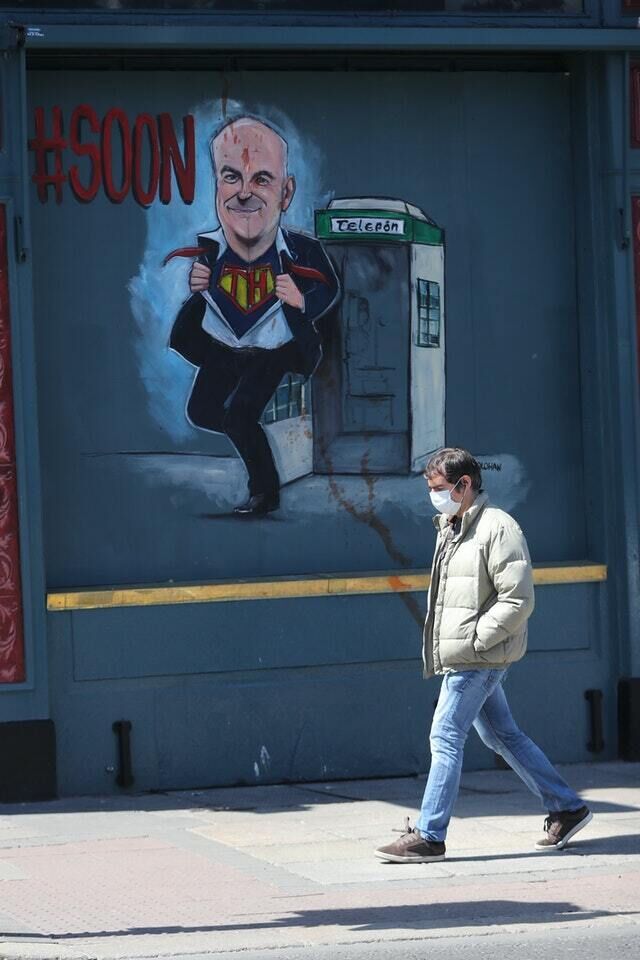 A man walks past a mural depicting Chief Medical Officer, Dr Tony Holohan, outside Davitts Pub on Camden Street, Dublin (Niall Carson/PA) A man walks past a mural depicting Chief Medical Officer, Dr Tony Holohan, outside Davitts Pub on Camden Street, Dublin (Niall Carson/PA)