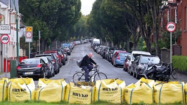 A clylist passes sandbags at Clontarf, Dublin this afternoon in preparation for Storm Lorenzo... Picture Colin Keegan, Collins Dublin