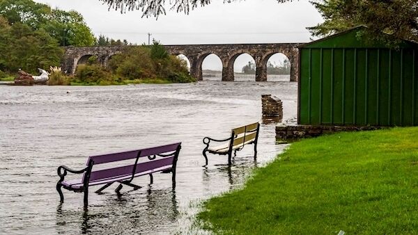 Flood waters engulf two benches near the famous 12 Arch Bridge in Ballydehob as a result of Storm Lorenzo. Picture: Andy Gibson