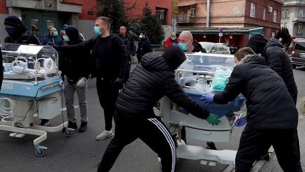 People carry incubators for newborn babies as the hospital is evacuated after an earthquake in Zagreb, Croatia, Sunday, March 22, 2020. A strong earthquake shook Croatia and its capital on Sunday, causing widespread damage and panic. (AP Photo/Darko Bandic) People carry incubators for newborn babies as the hospital is evacuated after an earthquake in Zagreb, Croatia, Sunday, March 22, 2020. A strong earthquake shook Croatia and its capital on Sunday, causing widespread damage and panic. (AP Photo/Darko Bandic)