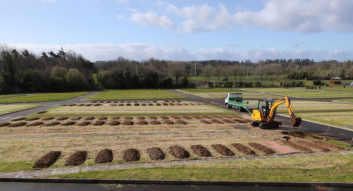 Rows of graves are prepared with the help of a mechanical digger in Sixmile Cemetery in County Antrim, in Northern Ireland, as the coronavirus death toll continues to rise. Photo: Niall Carson/PA Wire