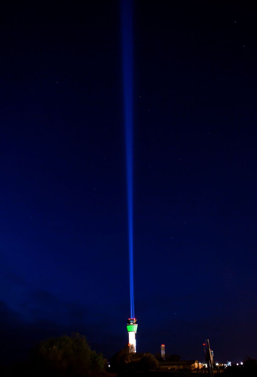 The Air Traffic Control Tower at Dublin Airport blasted its powerful beam into the sky in honour of everyone affected by the pandemic. Pic: Gary Ashe
