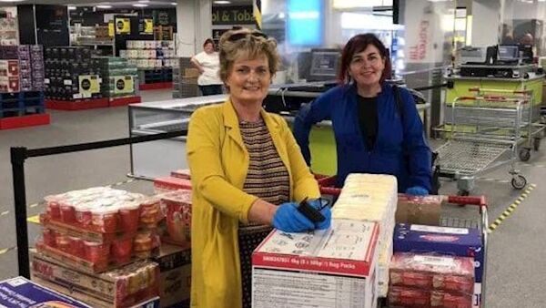 Yvonne Qullligan and Patricia Cotter with some of the packages of food for delivery. Friendly Call has augmented its service to fight isolation during the pandemic.