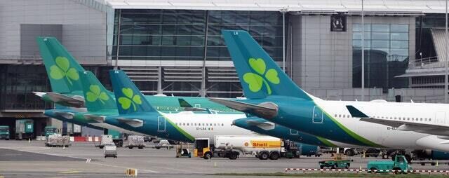 Aer Lingus jets parked up on the runway of Dublin airport as flights are down by 83% due to Coronavirus (Niall Carson/PA)
