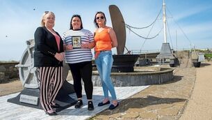 Kelly and Carmel Coady with their mother Rose in the memorial garden at Kilmore Quay, Co Wexford. Rose lost her son Pat on the Pere Charles in 2007. Picture: Dan Linehan